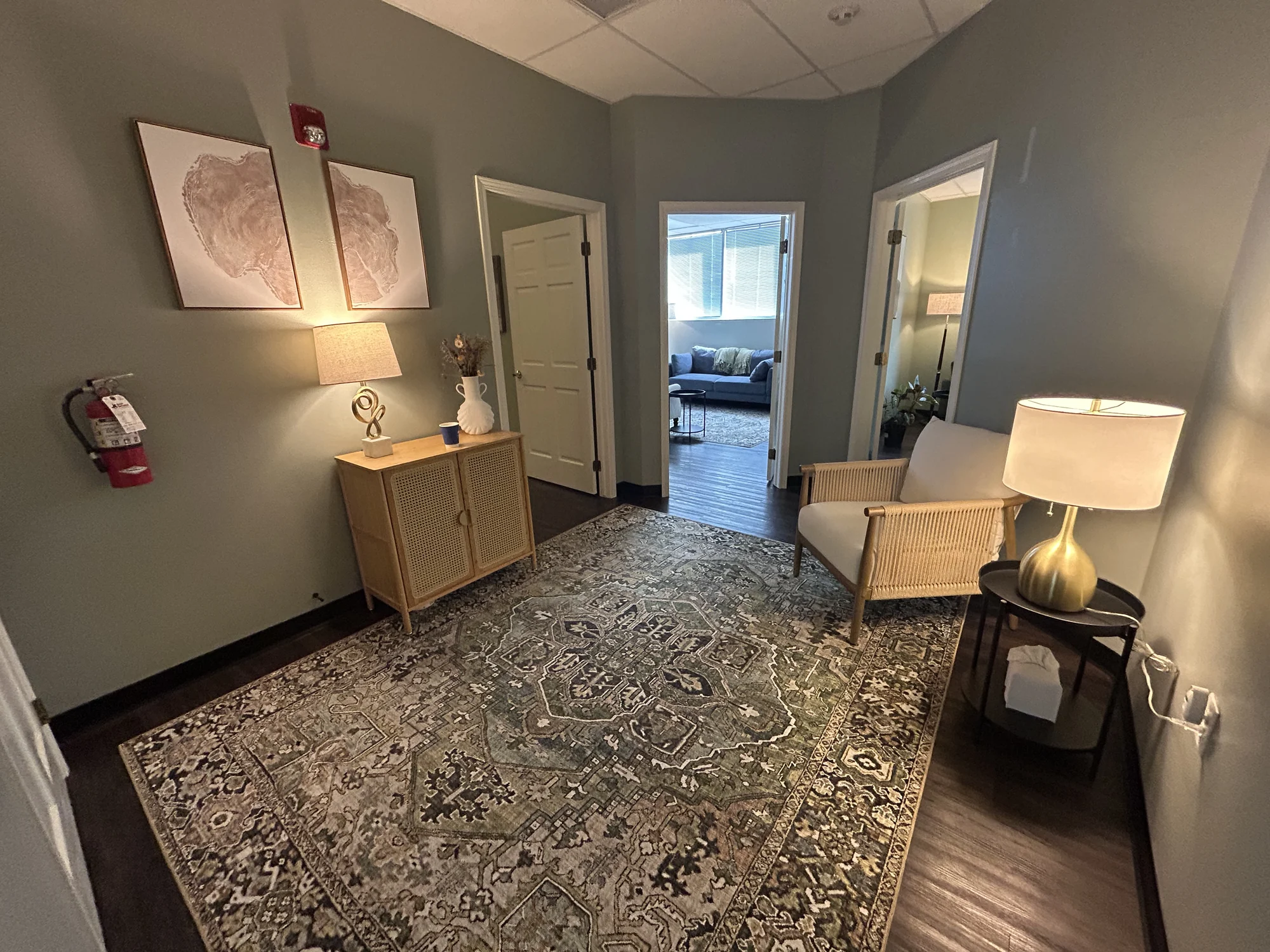 Internal view of Allis rooms with an open doorway and table lamps